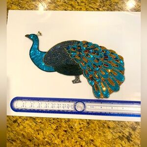 Peacock sequin appliqué.